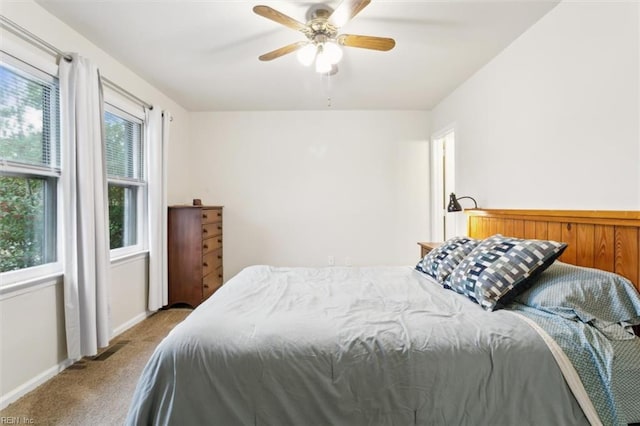 bedroom with ceiling fan and light colored carpet