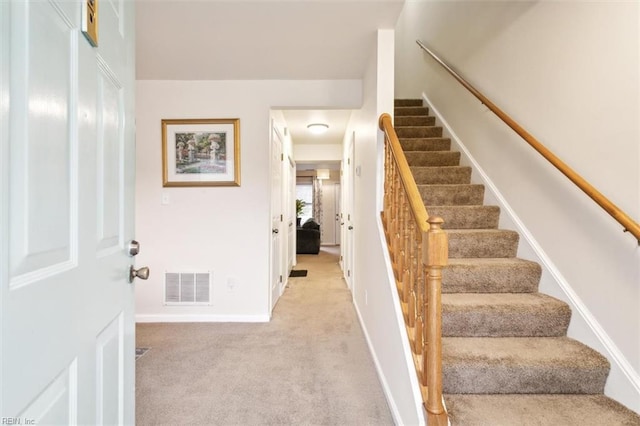 stairway with carpet floors