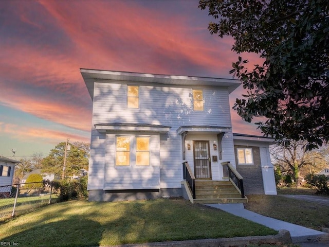 view of front of home with a lawn