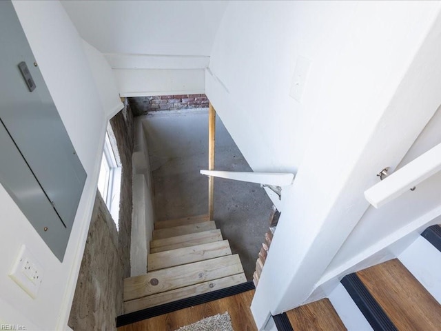 stairs featuring wood-type flooring