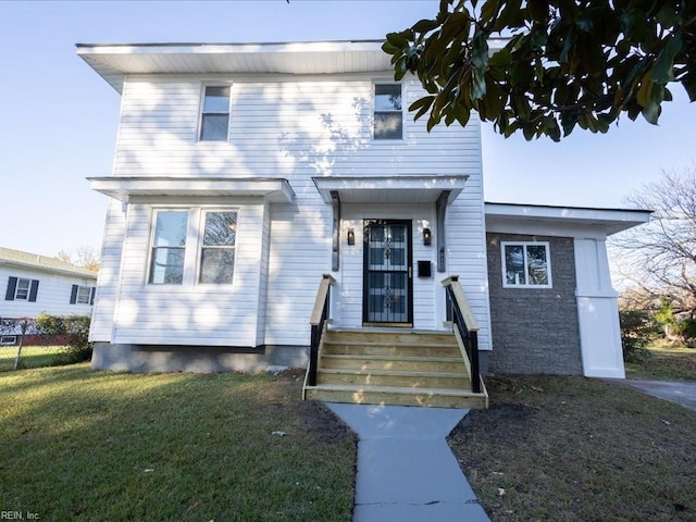 view of front facade featuring a front yard