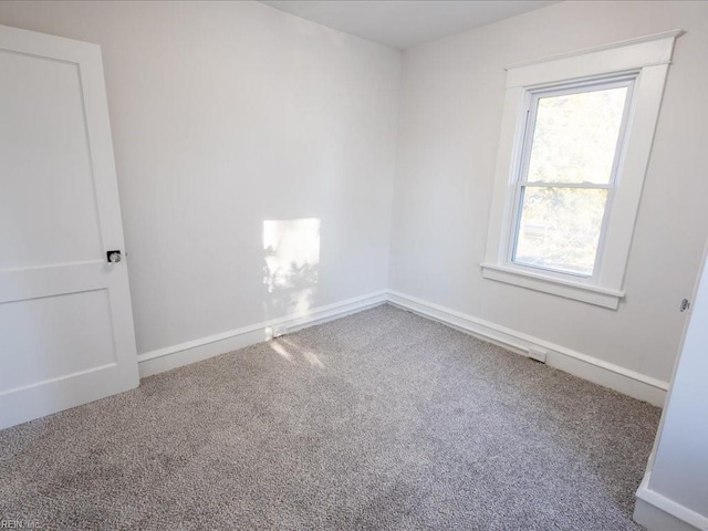 unfurnished room featuring carpet flooring