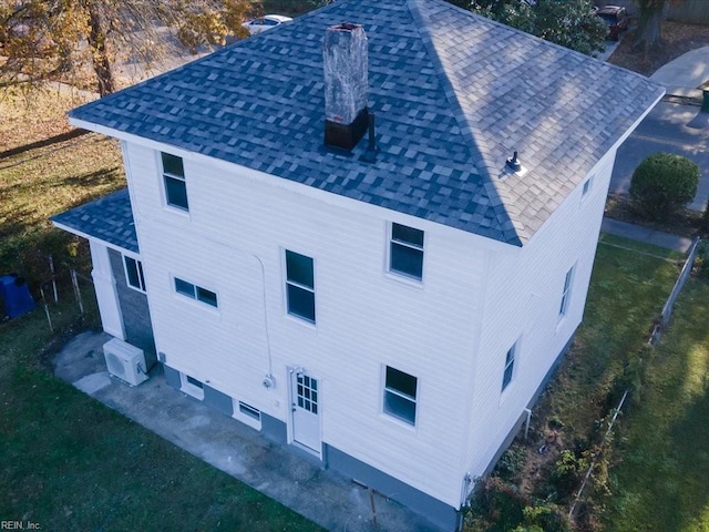 view of side of property with a lawn