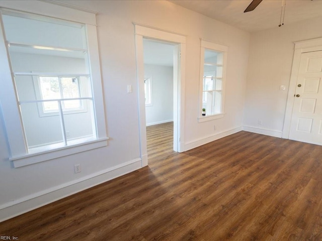 interior space with dark hardwood / wood-style floors and ceiling fan