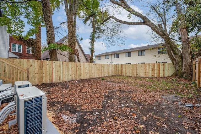 view of yard featuring central air condition unit