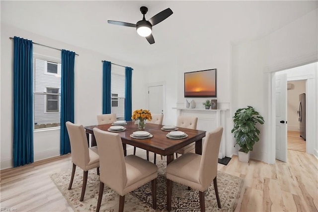 dining area featuring ceiling fan and light hardwood / wood-style floors