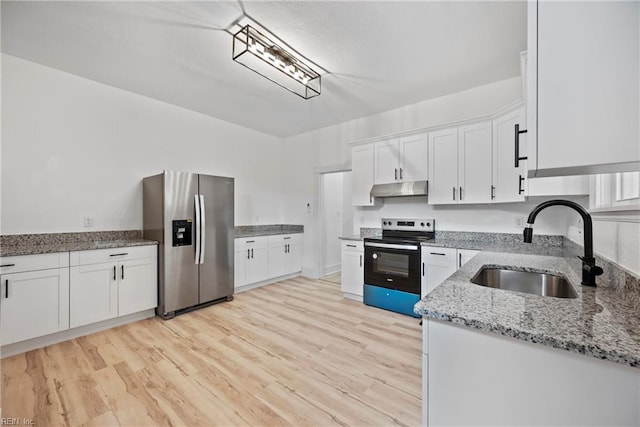 kitchen with white cabinets, stainless steel appliances, light hardwood / wood-style flooring, and sink