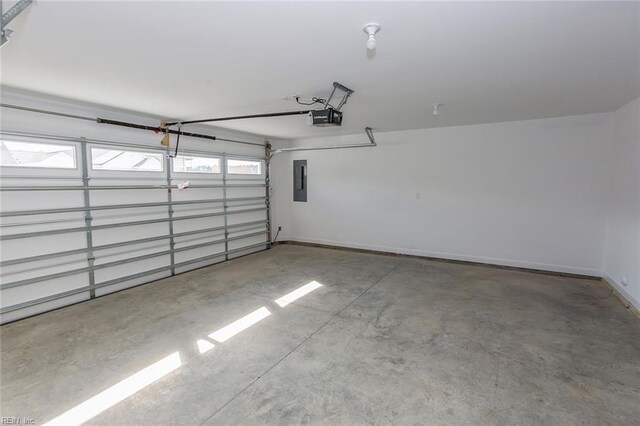 garage featuring electric panel and a garage door opener