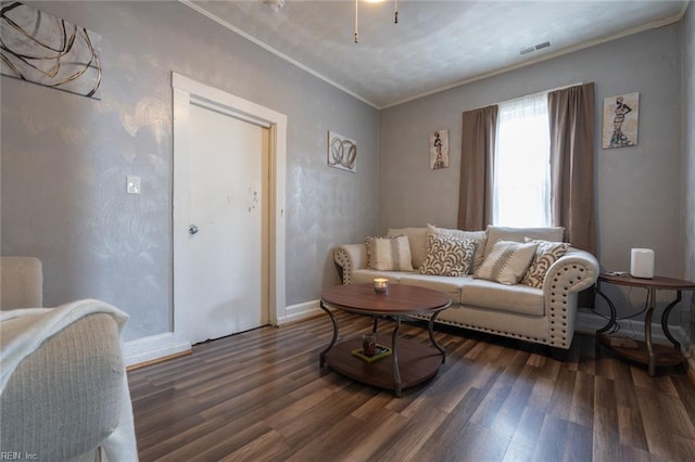 living room with dark hardwood / wood-style flooring and ornamental molding