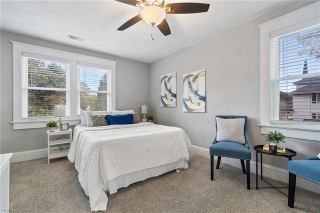 bedroom with light carpet and ceiling fan