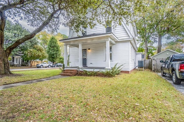 bungalow-style home with a front yard and a porch