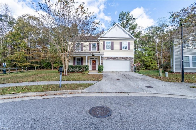 view of front of house with a garage and a front lawn