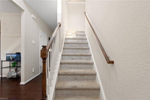 stairway featuring hardwood / wood-style floors