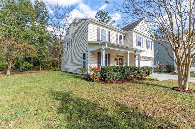 view of front of house with a porch, a garage, and a front lawn