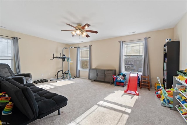 game room featuring carpet and ceiling fan