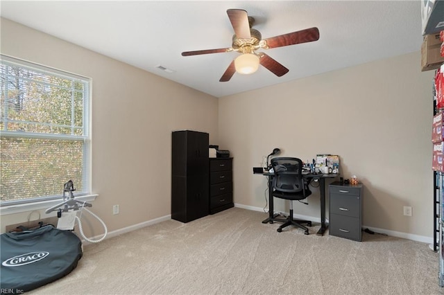 office with ceiling fan and light colored carpet