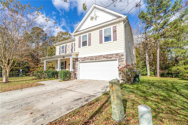 view of front of house featuring a front lawn and a garage