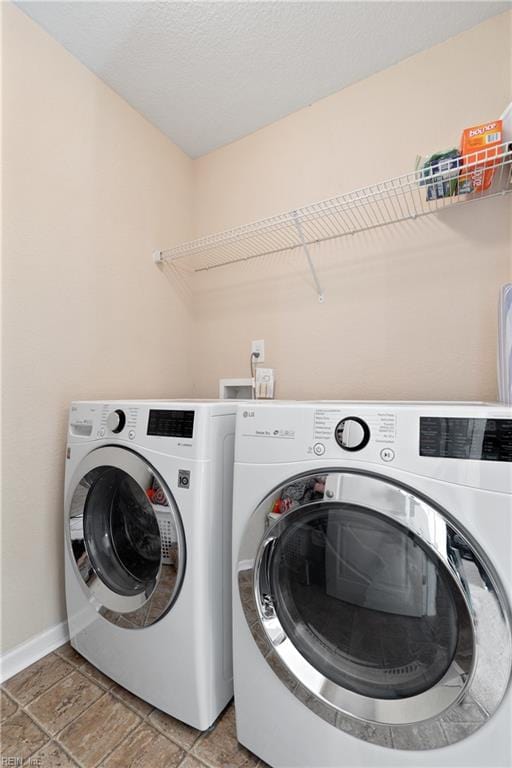 laundry area with separate washer and dryer