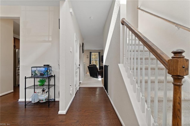 hallway featuring dark hardwood / wood-style floors