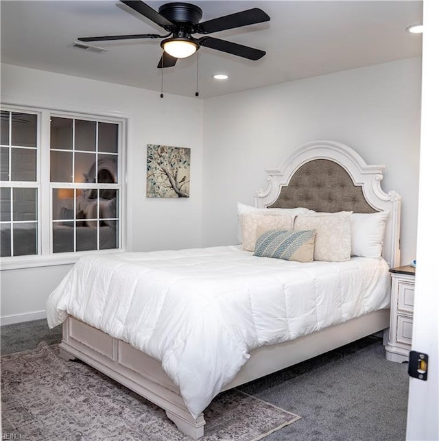 bedroom with ceiling fan and carpet floors