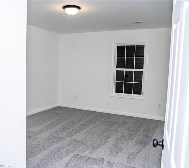 empty room with carpet flooring