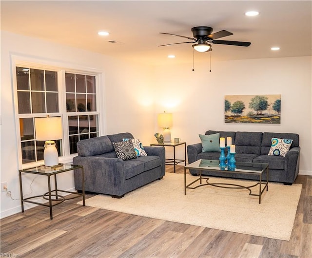 living room with hardwood / wood-style floors and ceiling fan