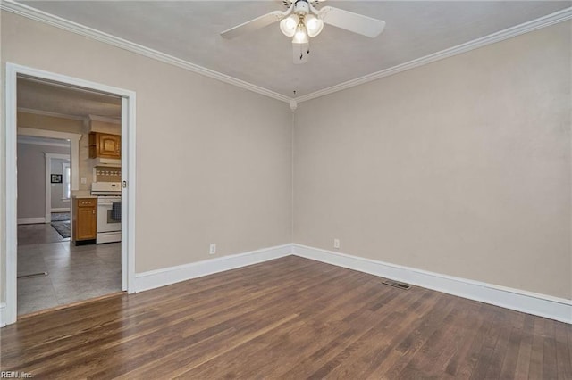 spare room featuring ceiling fan, dark hardwood / wood-style floors, and ornamental molding