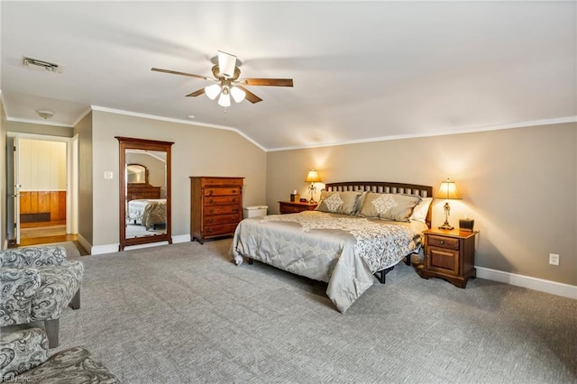 carpeted bedroom featuring ceiling fan, vaulted ceiling, and ornamental molding