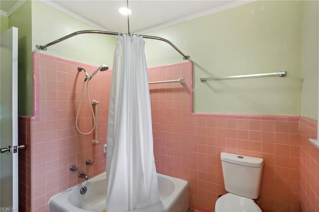 bathroom with shower / tub combo, toilet, tile walls, and ornamental molding