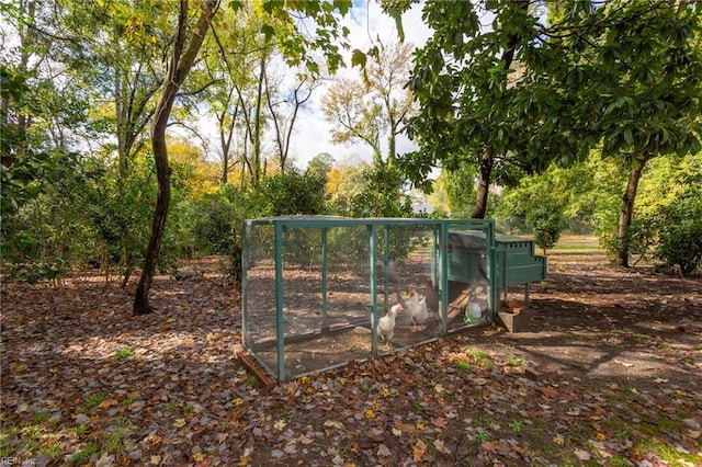 view of gate featuring an outdoor structure