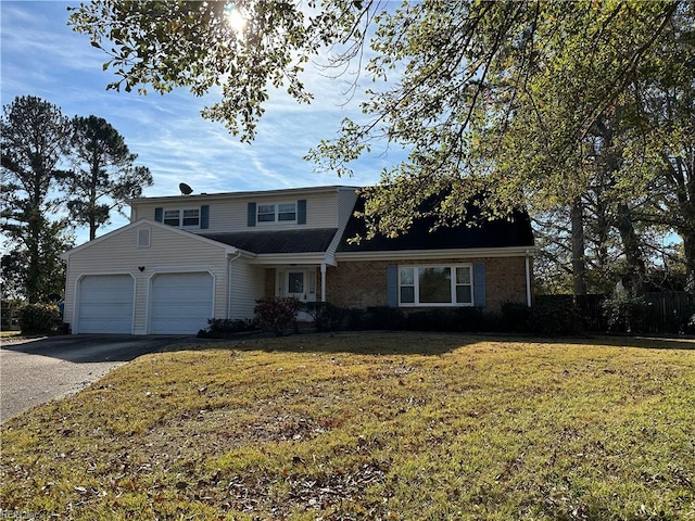 view of front property featuring a garage and a front lawn