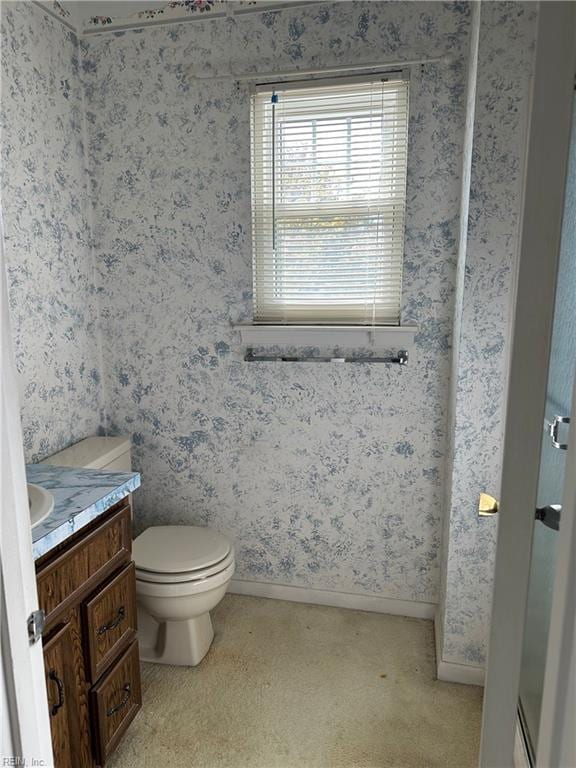 bathroom featuring vanity and toilet