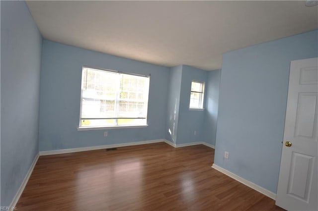 empty room featuring hardwood / wood-style flooring