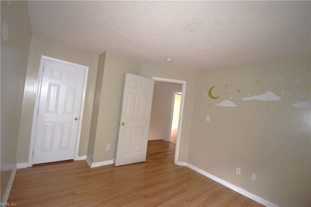 spare room featuring light hardwood / wood-style flooring