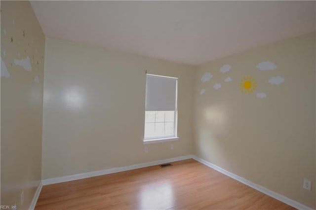 empty room with light wood-type flooring