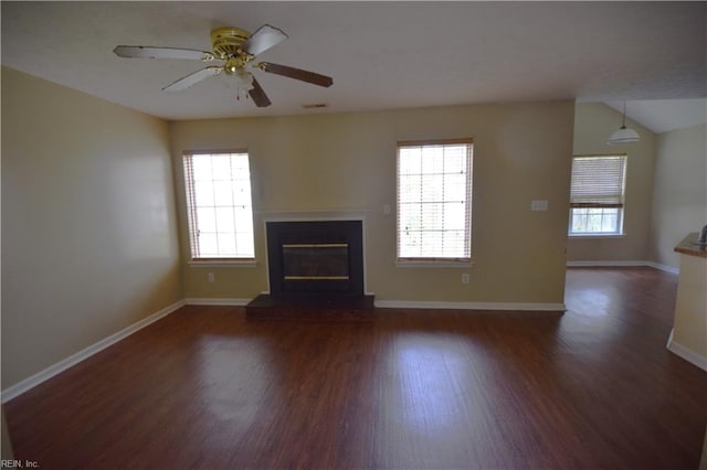 unfurnished living room with dark hardwood / wood-style floors and ceiling fan