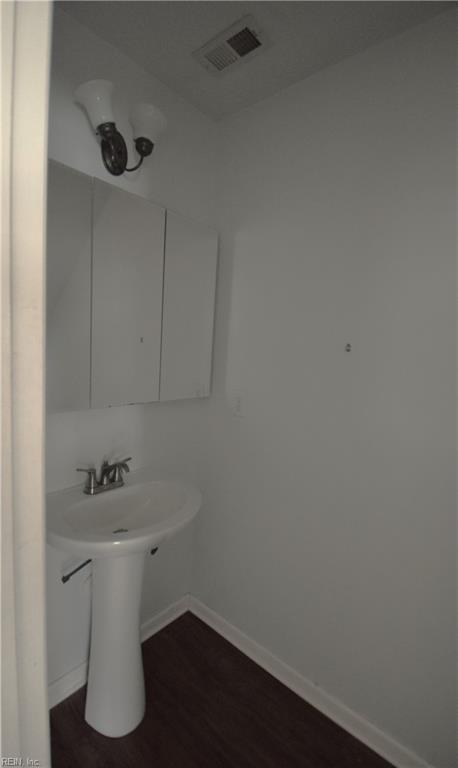 bathroom featuring wood-type flooring