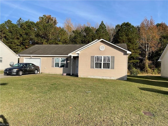 view of front of property featuring a front yard and a garage