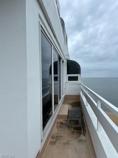 balcony featuring a water view