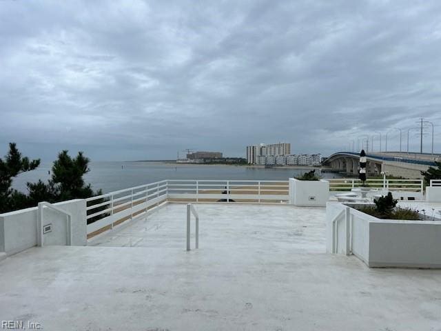 view of patio with a water view