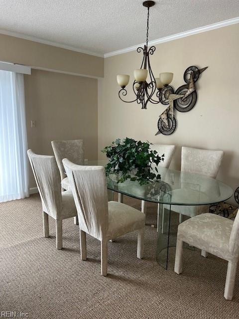 dining room with carpet flooring, crown molding, a textured ceiling, and an inviting chandelier