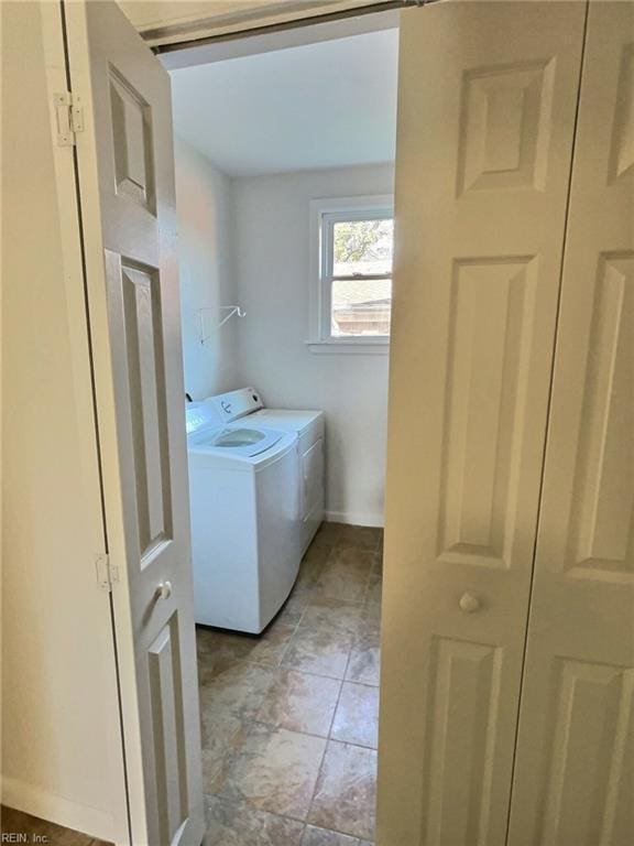 laundry room featuring washing machine and clothes dryer