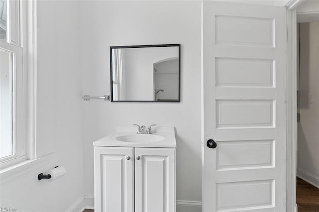 bathroom featuring vanity and wood-type flooring