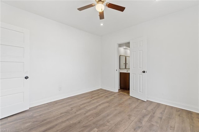 spare room with ceiling fan and light hardwood / wood-style floors