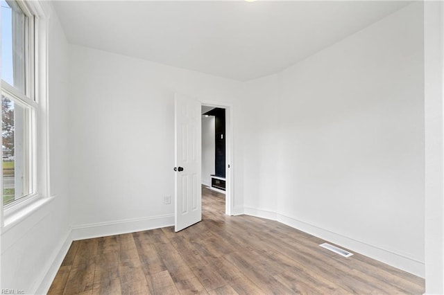 empty room featuring hardwood / wood-style flooring