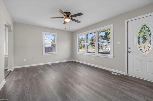 foyer entrance featuring dark hardwood / wood-style floors and ceiling fan