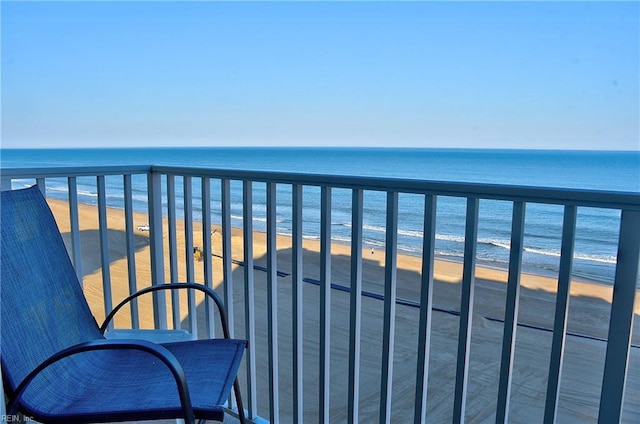 balcony with a view of the beach and a water view