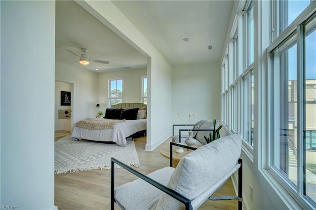 bedroom featuring ceiling fan and light hardwood / wood-style flooring