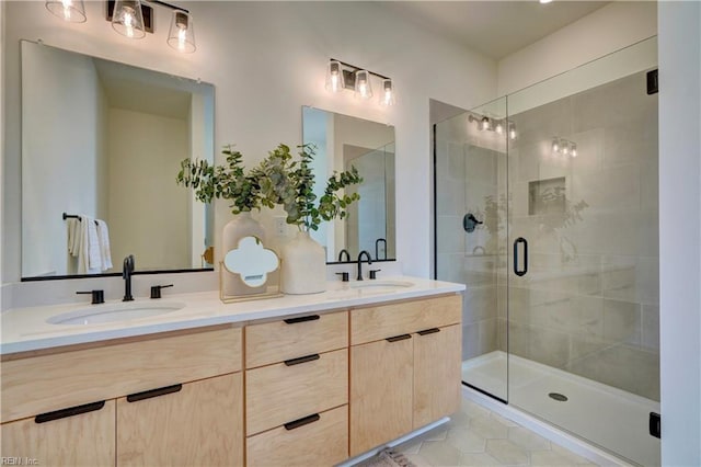 bathroom with tile patterned flooring, vanity, and a shower with shower door