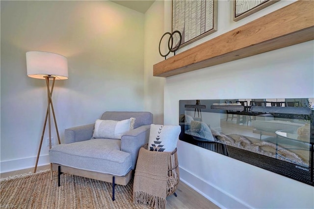 living area with light hardwood / wood-style flooring